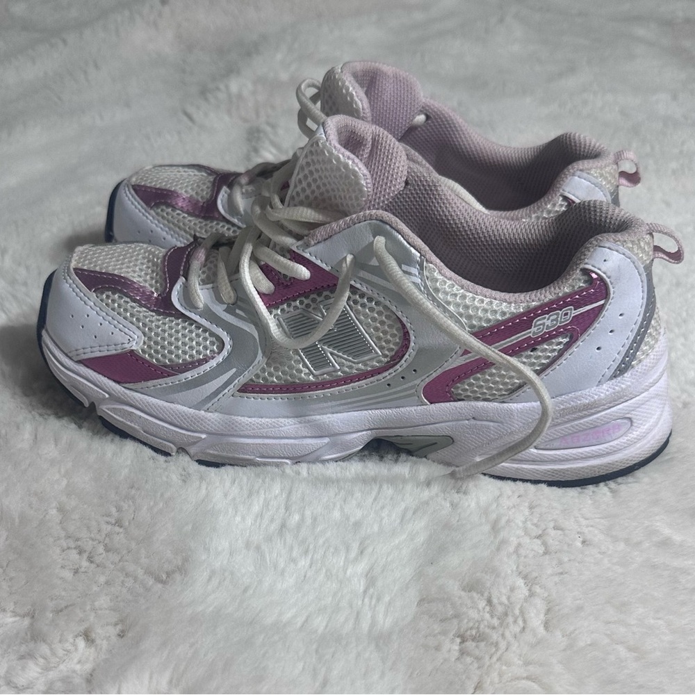 Woman’s New Balance White and Pink Athletic Sneakers